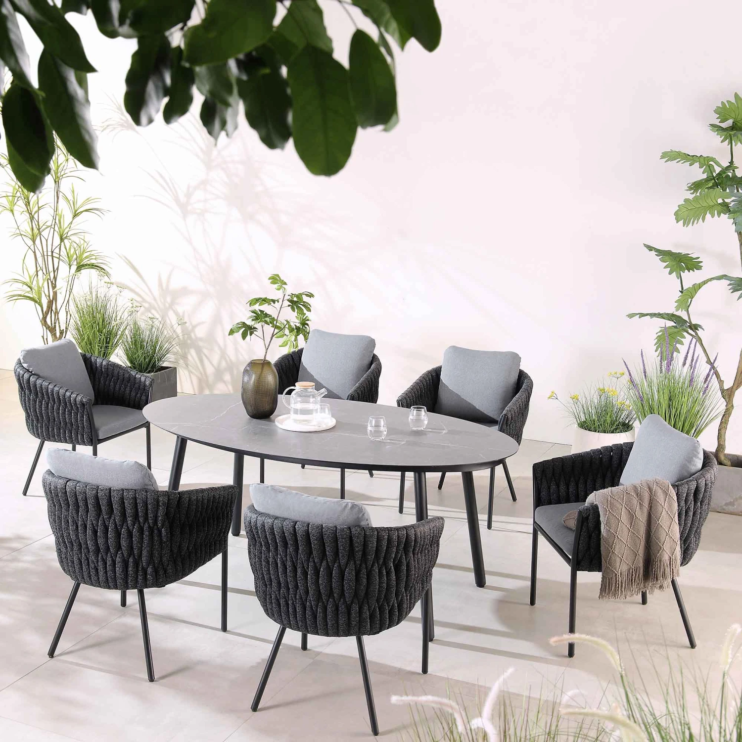Montebello 6-Seater Outdoor Black Rope And Aluminium Oval Dining Set With Grey Ceramic Dining Table 1 Montebello 6-Seater Outdoor Black Rope And Aluminium Oval Dining Set With Grey Ceramic Dining Table
